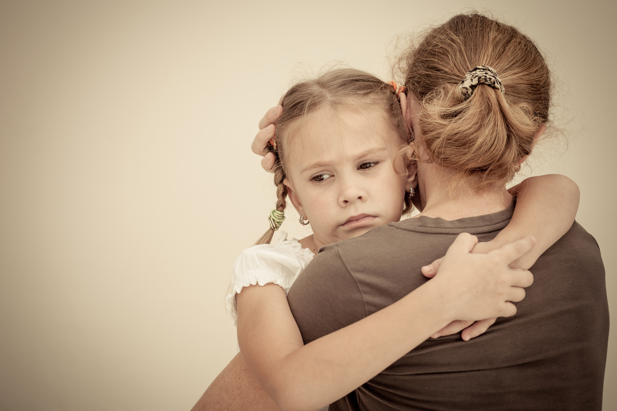 sad daughter hugging his mother